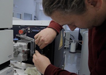 Dr. Petr Novak with the mass spectrometry platform he uses for characterizing NK cells